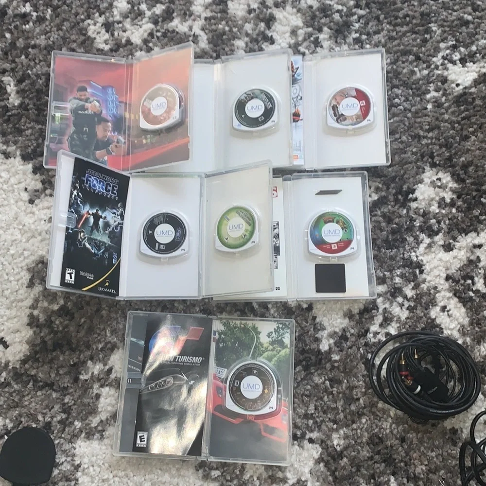 PSP Bundle with 7 games + case and extra disc holder and TV cables